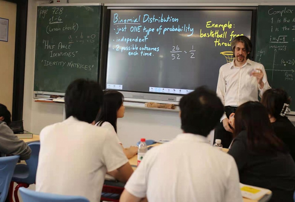 man teaching class in china