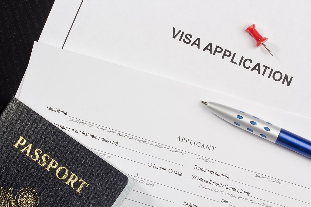 visa application paperwork and passport