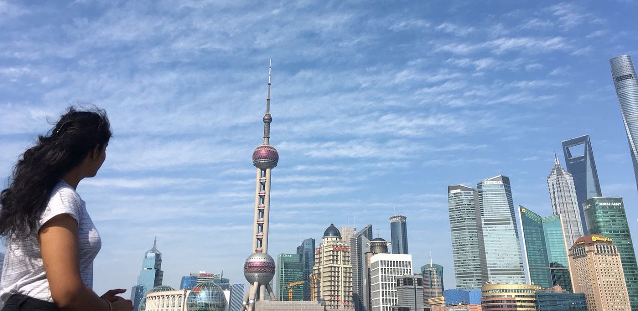 Woman looking at skyscrapers